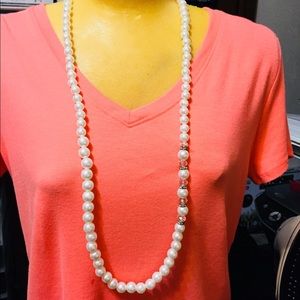 Long pearl necklace with clear beads on one side